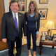 Ed Martin and Lindsey Halligan posing together in his office. They both look really weird, with him being bottom-heavy and forward leaning,and her propped up on ugly shoes.